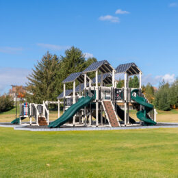 A commercial playground in a rubber mulch bed.