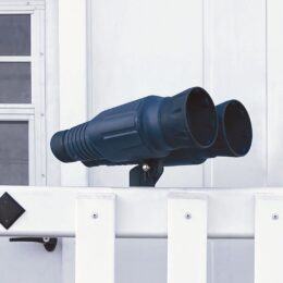 Gray plastic binoculars on a playground.